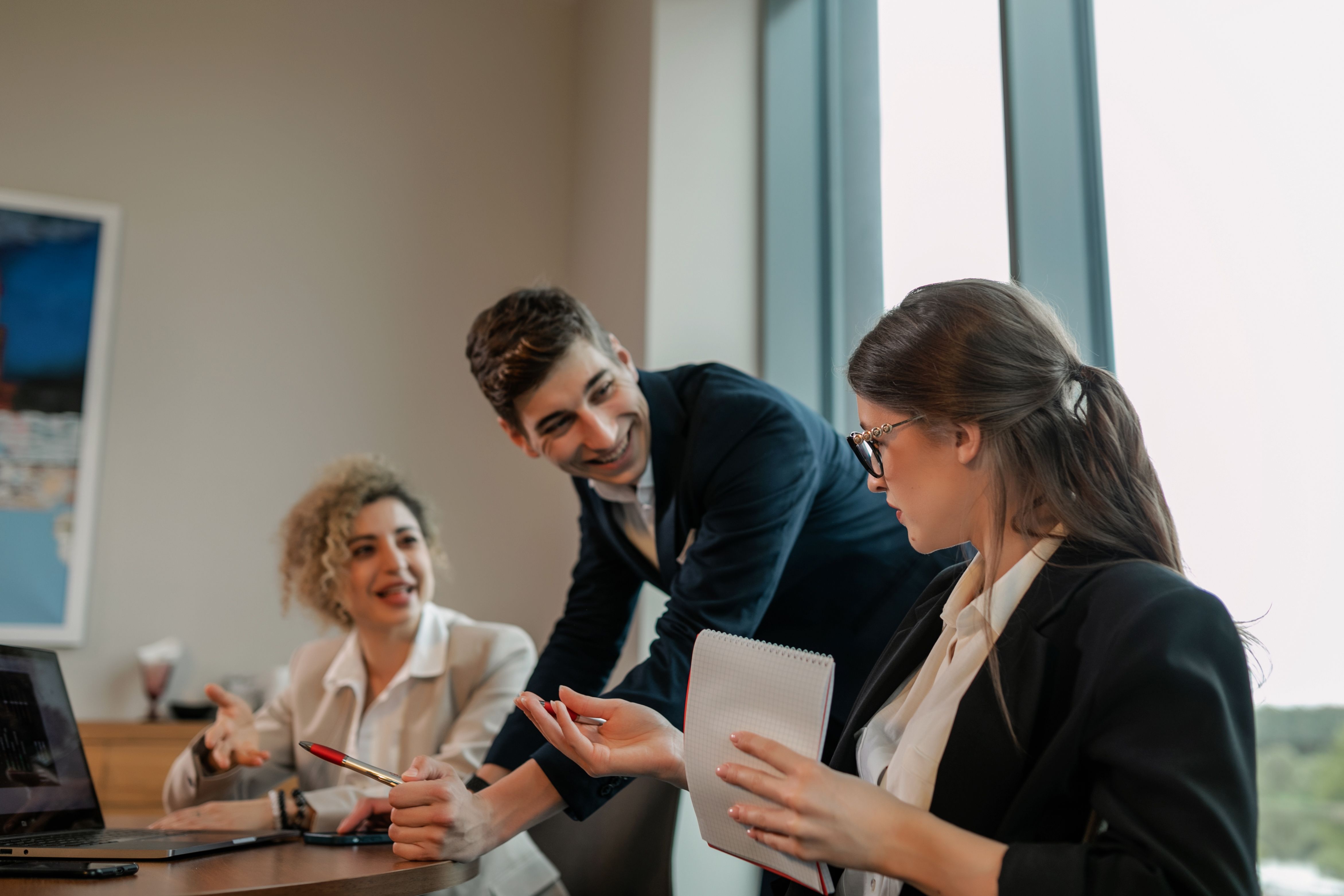 An international team in a meeting, speaking together in English