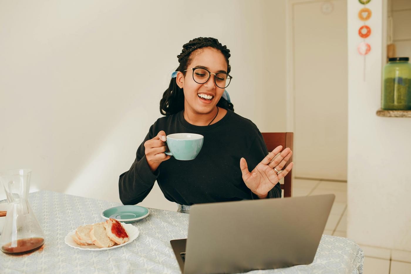 Two friends video-calling into a live SpeakDaily class from home